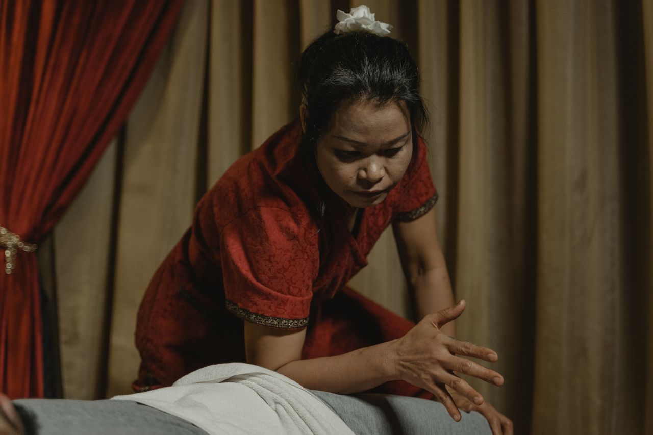 A therapist preparing a treatment room